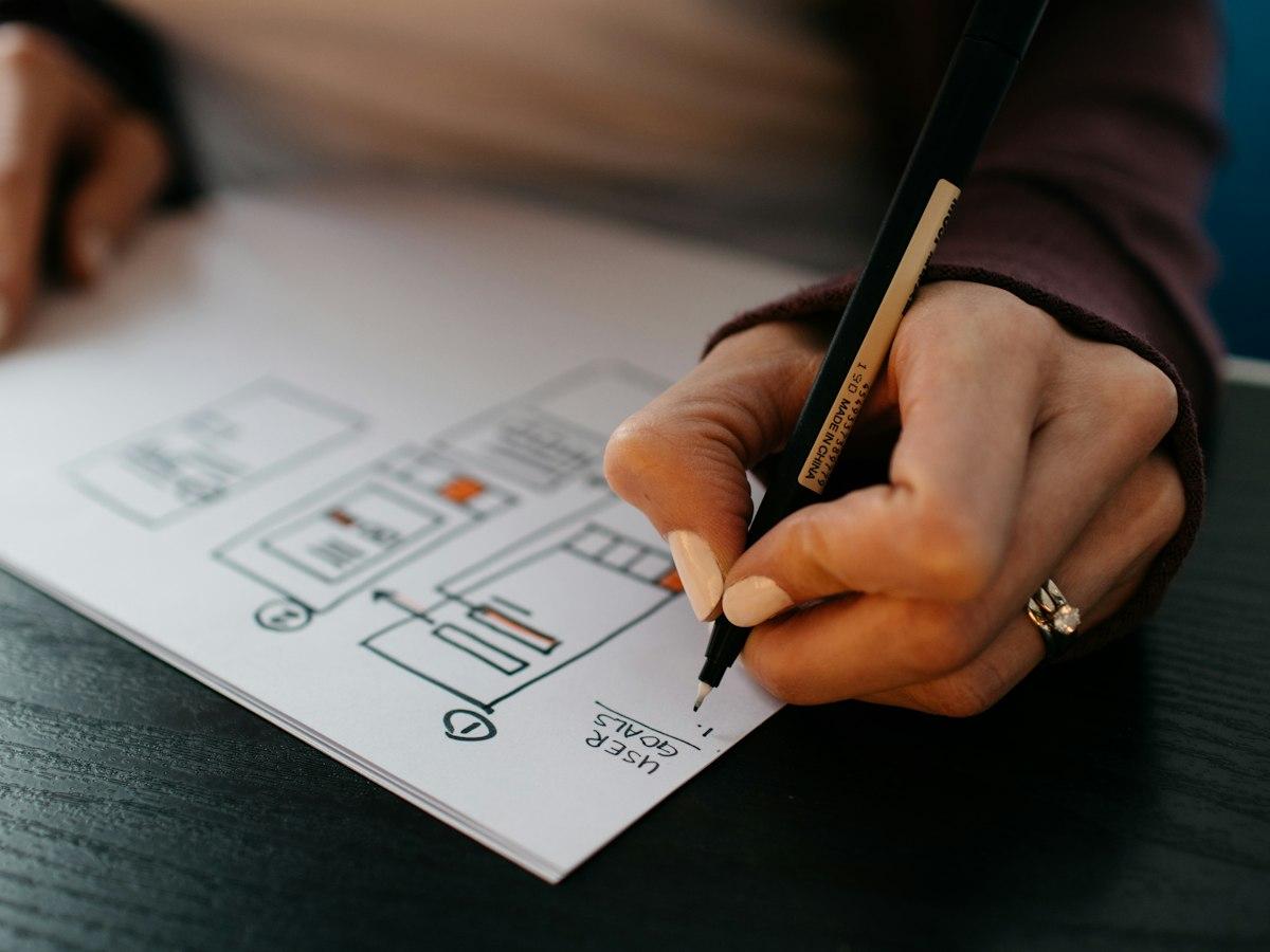 A designer laying out colour swatches and identity sketches